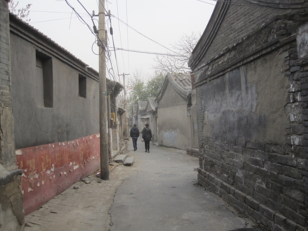 An unglamourous back road of single story buildings surprisingly close to Forbidden City.