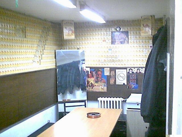 A staff rest room entirely lined by Camel cigarette packets.